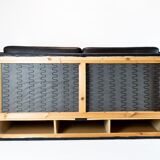 Two seater sofa upholstered with black leather and of danish design