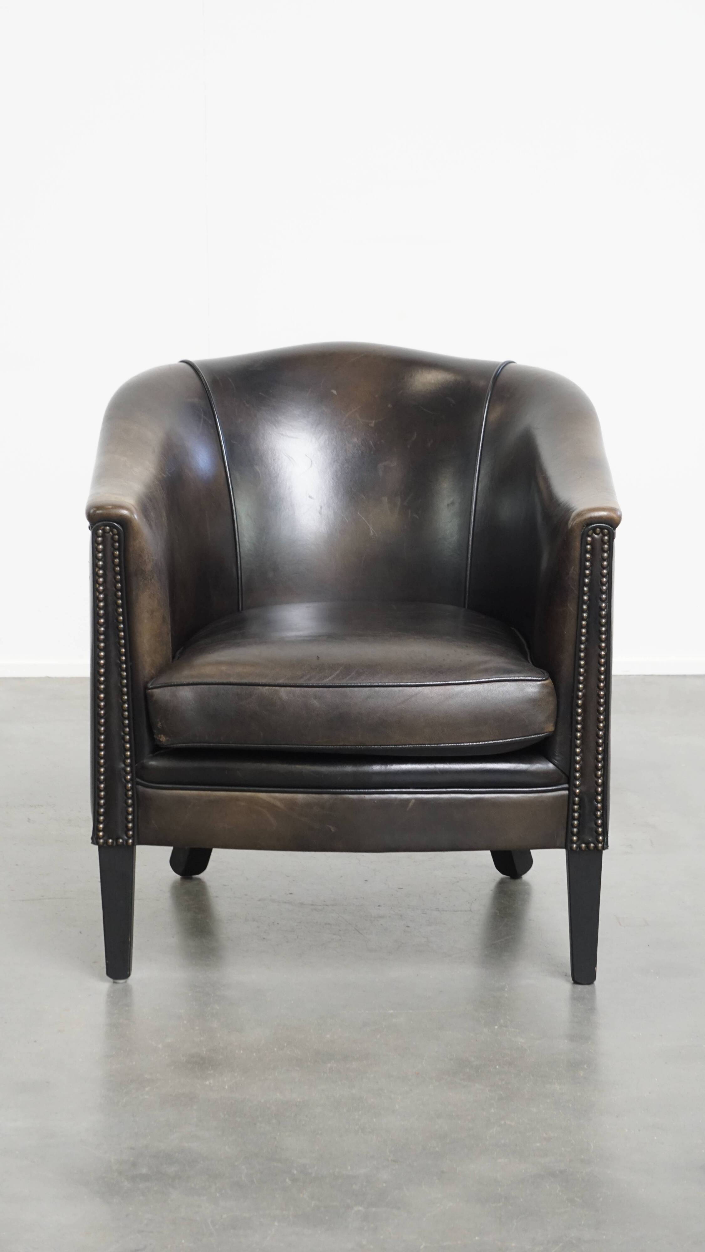 Fauteuil club noir/gris en cuir de mouton