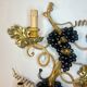 Large pair of wall sconces with vine decorations.