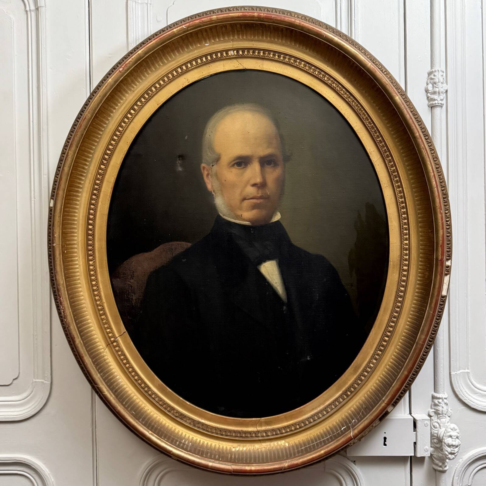 Oil on canvas portrait of a man, late 19th century, oval frame gilded with gold leaf.