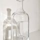 Kosta Boda carafe in blown glass 26 cm with sculptural imprint • Sweden