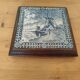 Ceramic tile trivet and wooden frame with Dutch windmill.