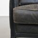 Armchair in black cowhide leather and wood with an Art Deco design