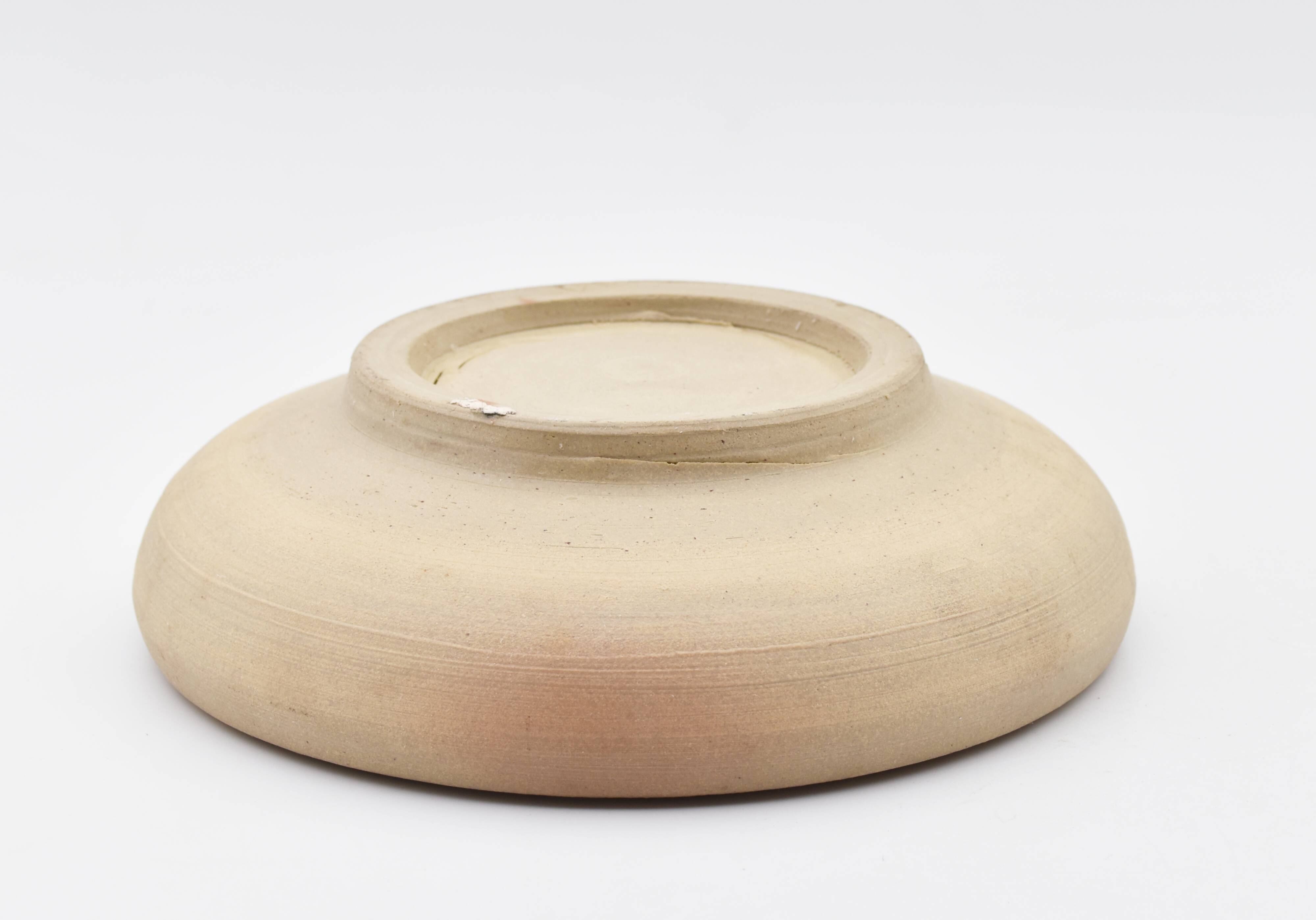 Blue enamelled sandstone cup