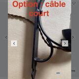 Two wrought iron wall lights, fabric cable.