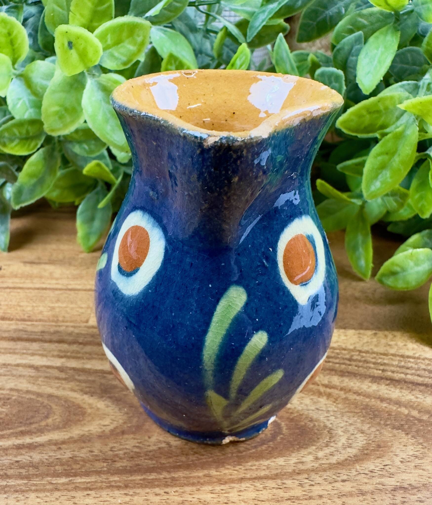 Small blue ceramic jug with hand-painted floral decoration, vintage.