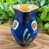 Small blue ceramic jug with hand-painted floral decoration, vintage.