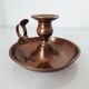 Set of a pair of candle holders and a hand candle holder