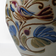 Vintage ceramic vase with bird decoration, signed.
