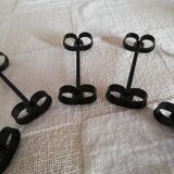 Set of 12 black twisted wrought iron knife holders from the 50s