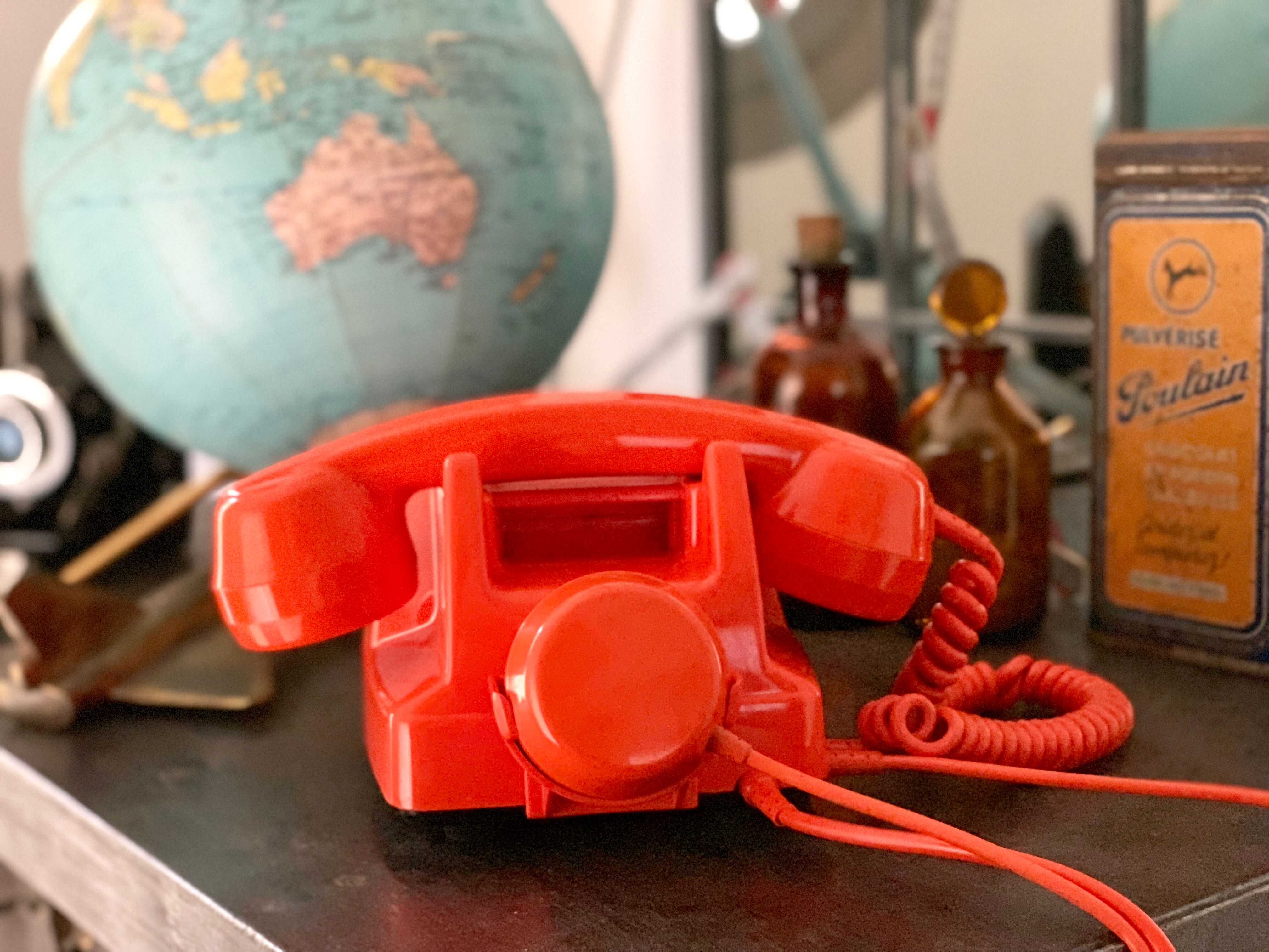 Old orange vintage dial phone