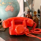 Old orange vintage dial phone
