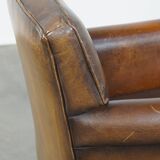 Sheepskin leather armchair with character and a touch of Art Deco design