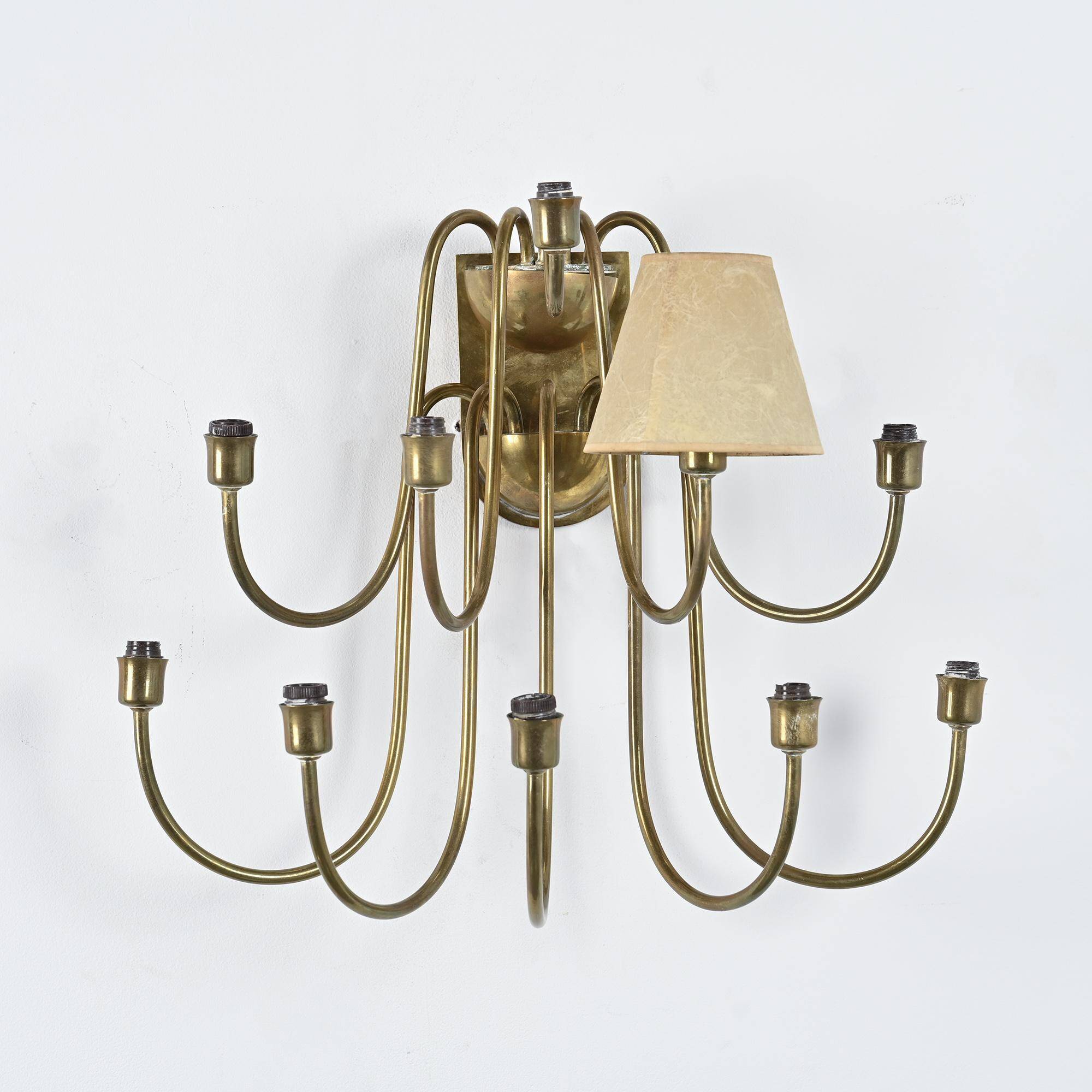 Wall sconce with nine arms in brass, France, circa 1950.