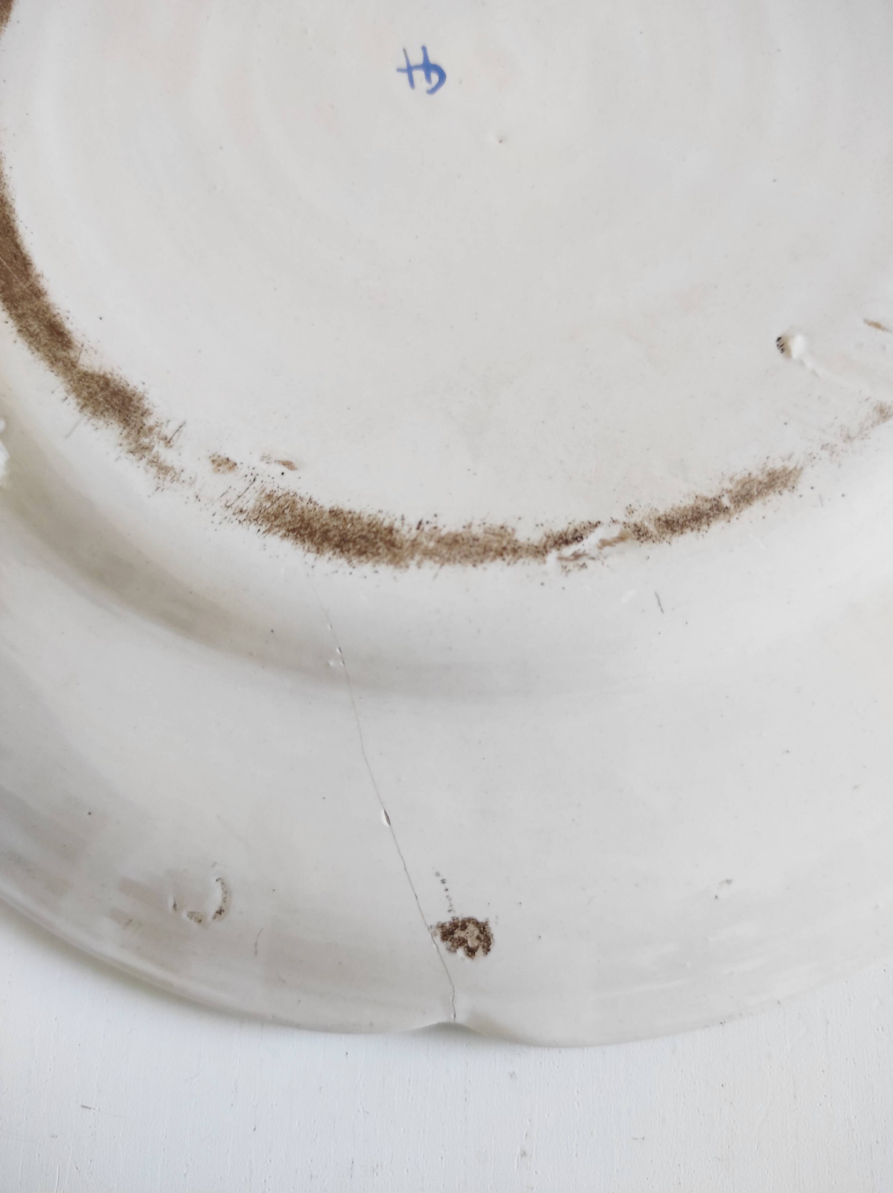 Eastern earthenware plate with flowers