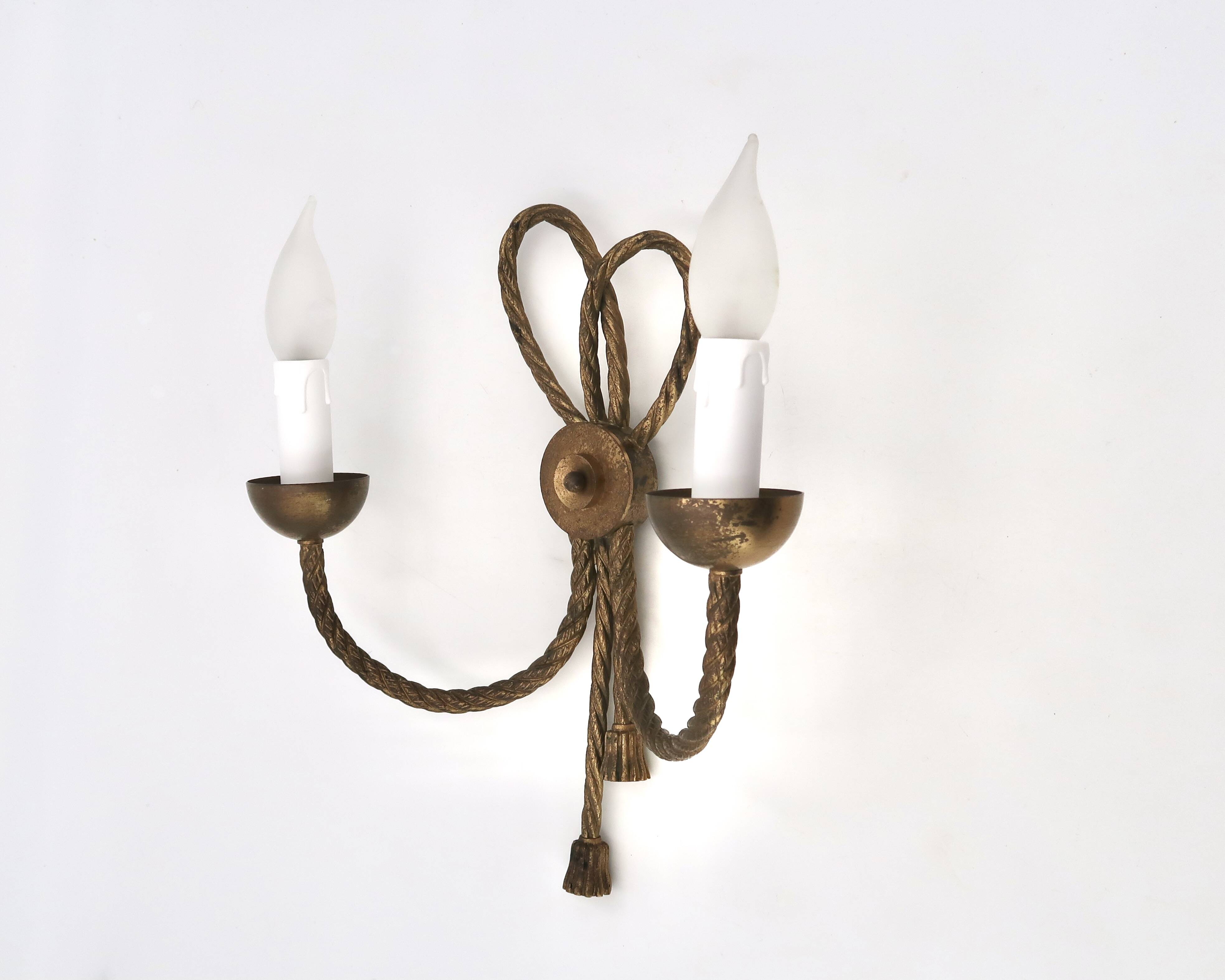 Golden wall lamp with two arms, decorated with a twisted rope bow, 1950s.