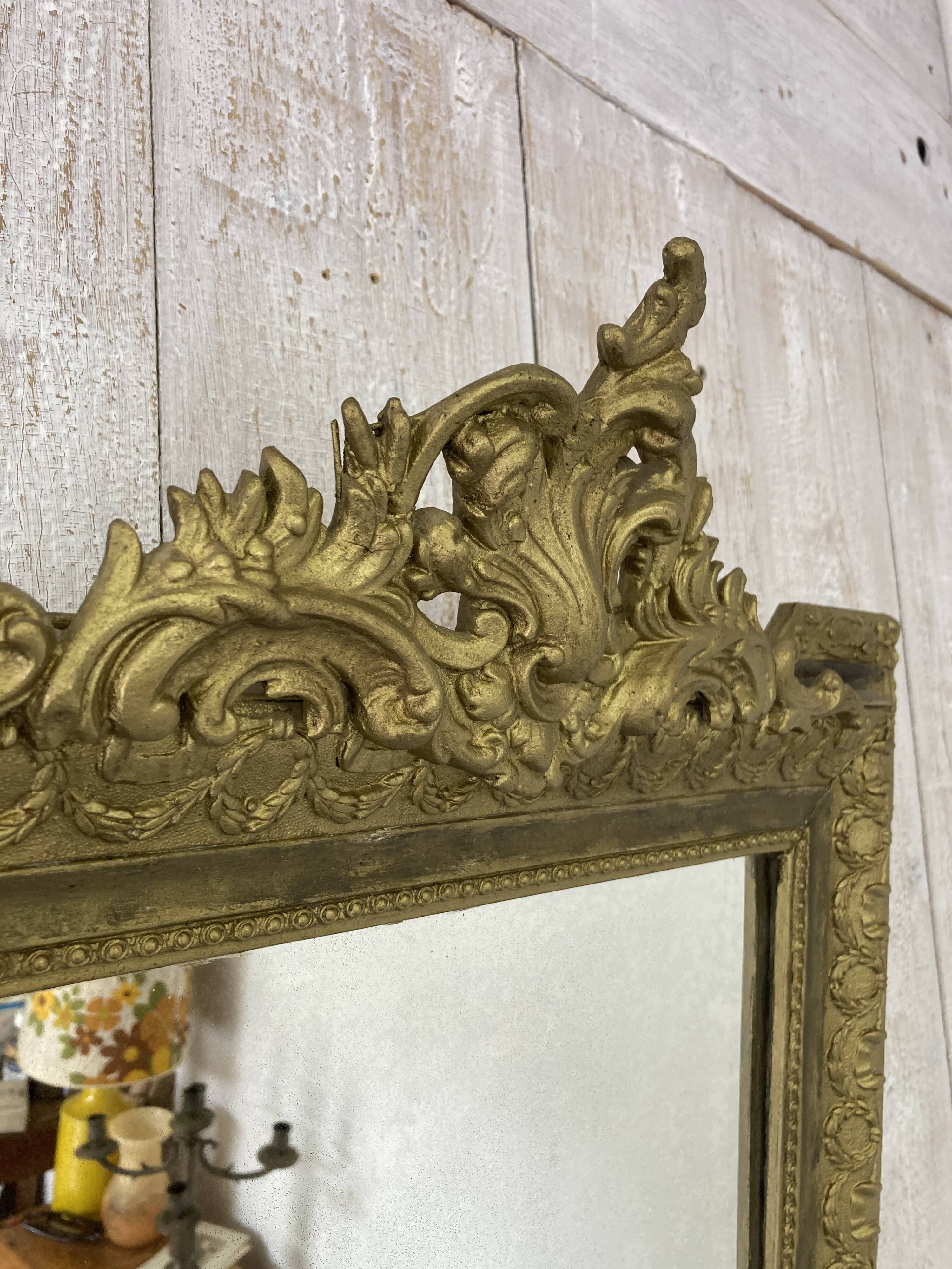 Antique mirror with a pediment
