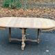 Extendable round farmhouse dining table restored in solid oak from the 19th century