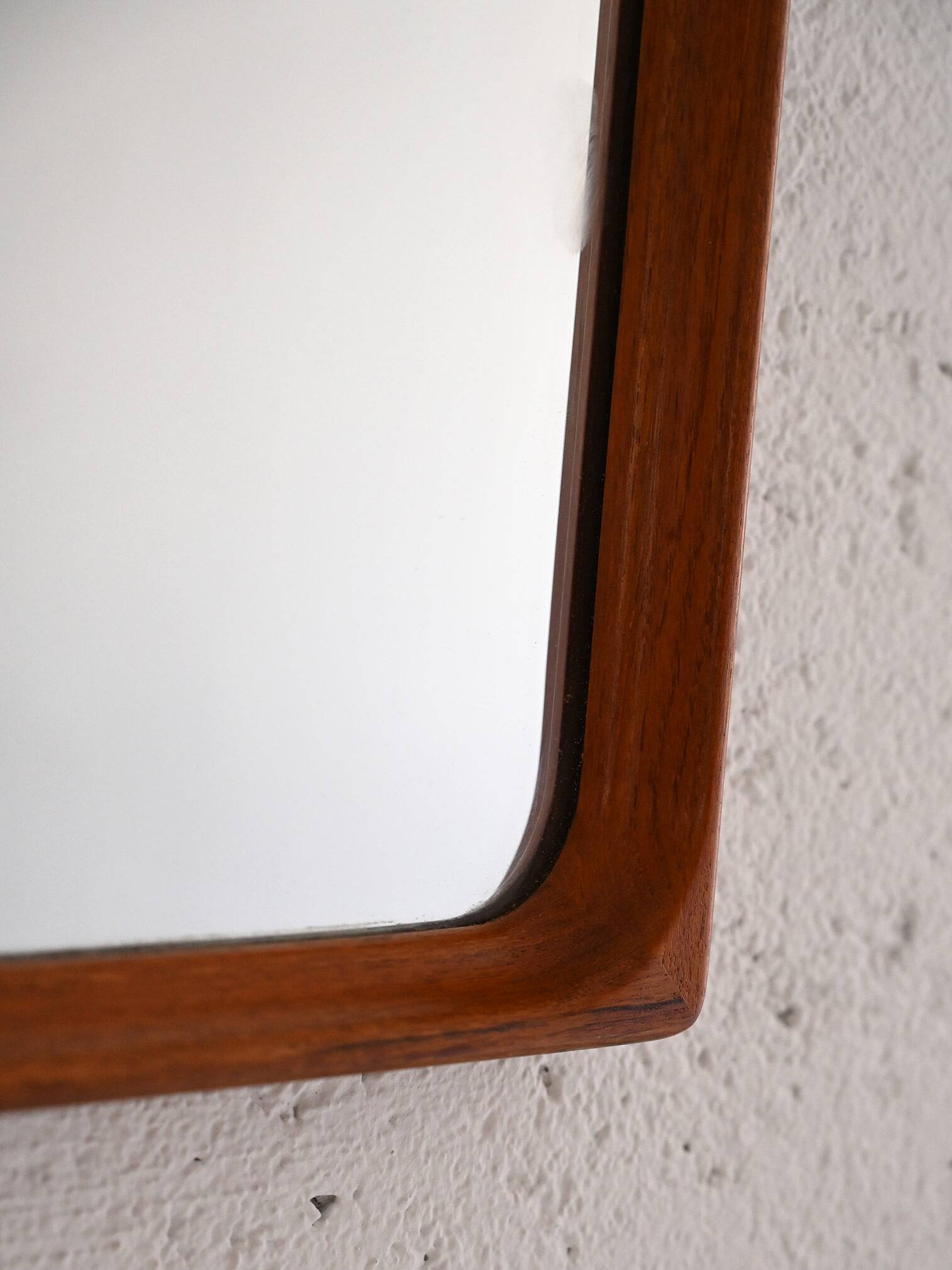 Vintage half-bust mirror with wooden frame