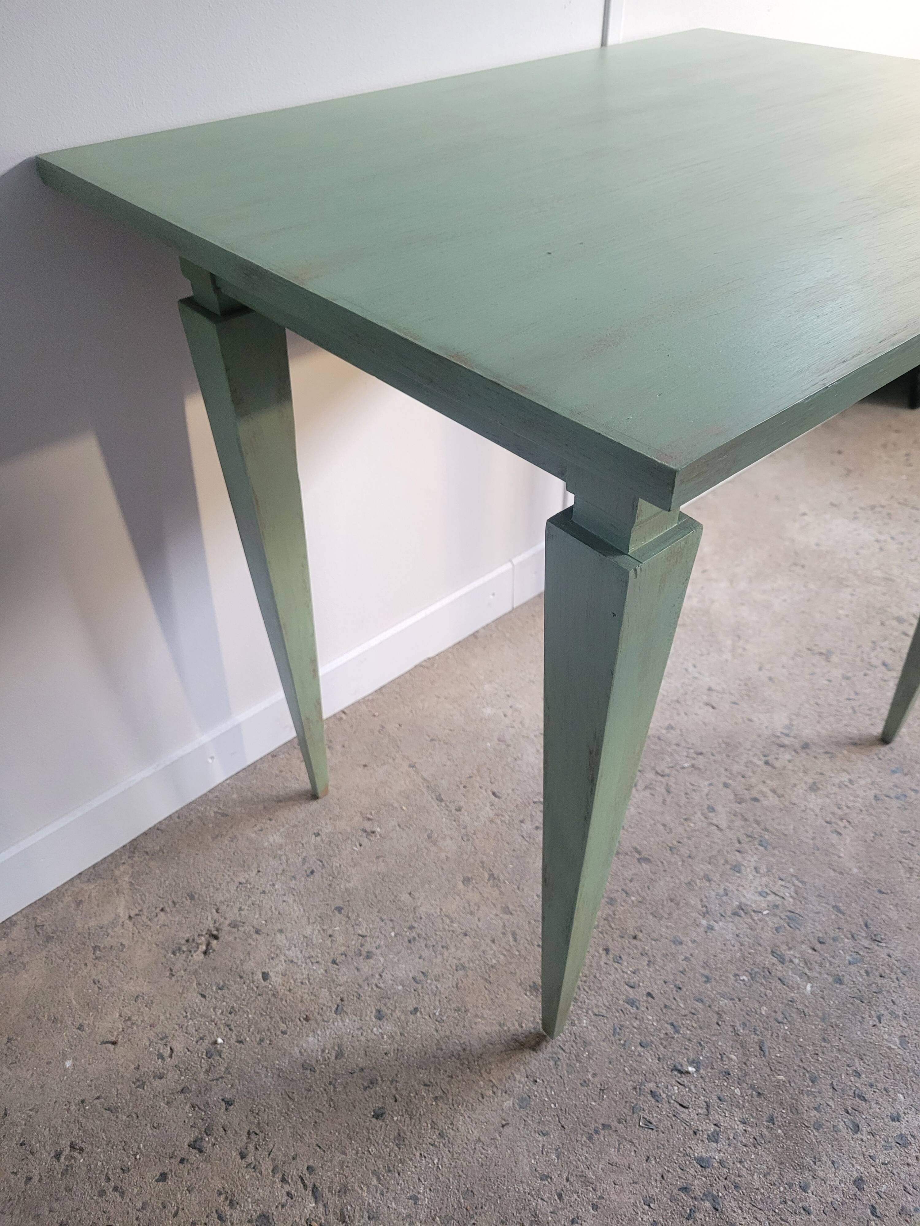 Green side table with tapered legs