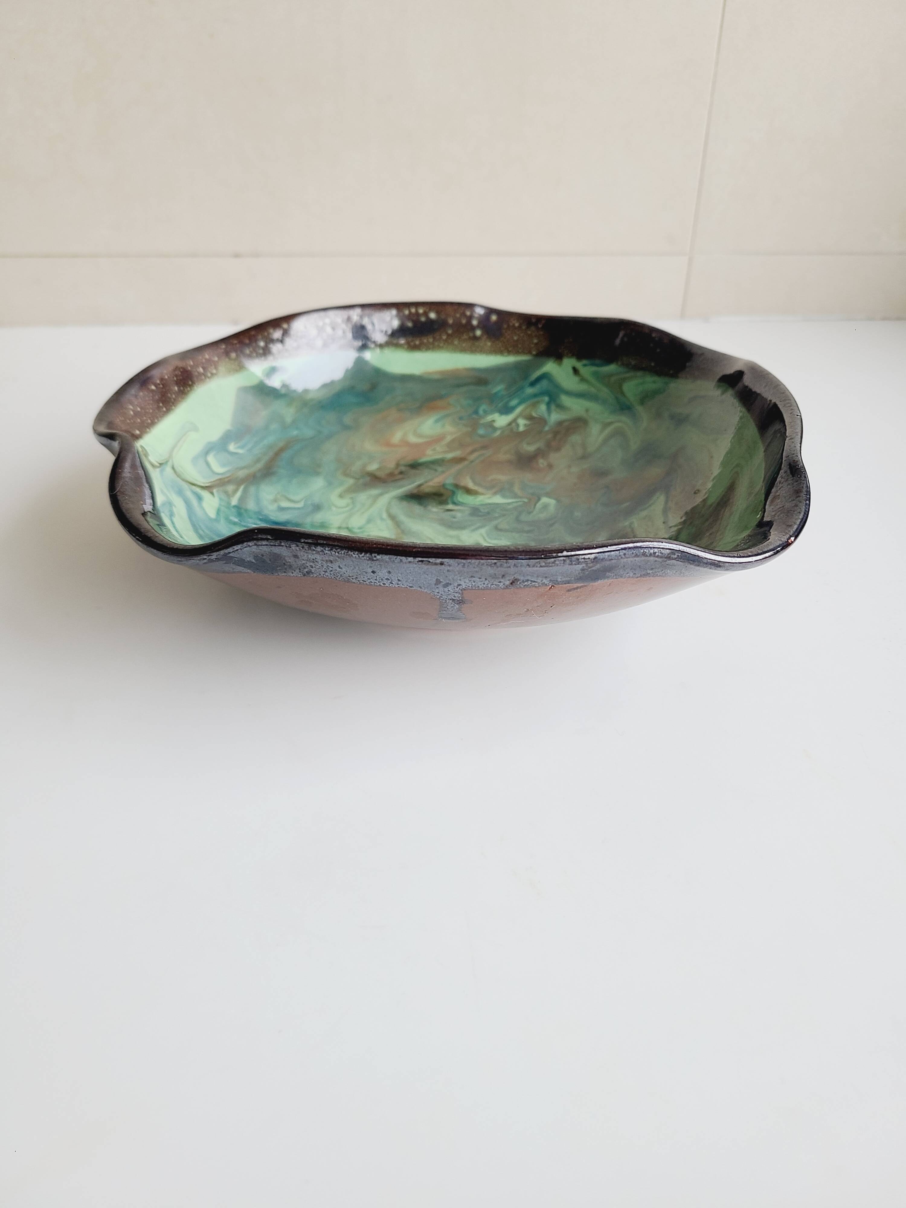 Handmade ceramic pocket emptier