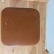 Caramel skaï stool and tapered feet in chrome metal