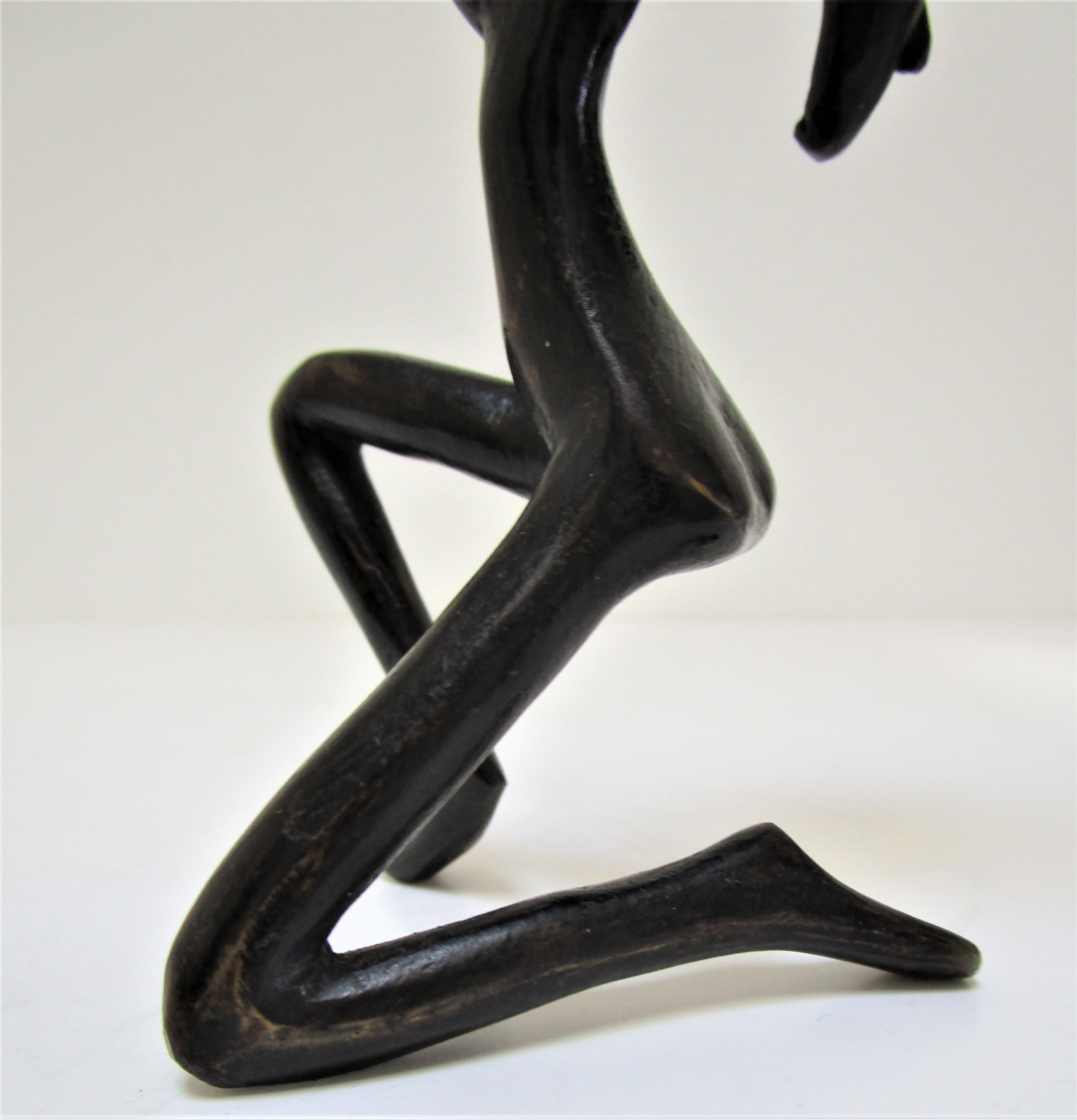 Sculptural candlestick anthropomorphic bronze blackened with woman's figure 70s