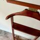 Reguitti valet on casters in dark wood