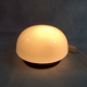 Opaline Scandinavian style bedside lamp on wood