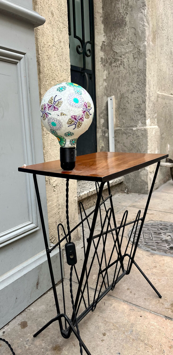 Newspaper holder with bulb