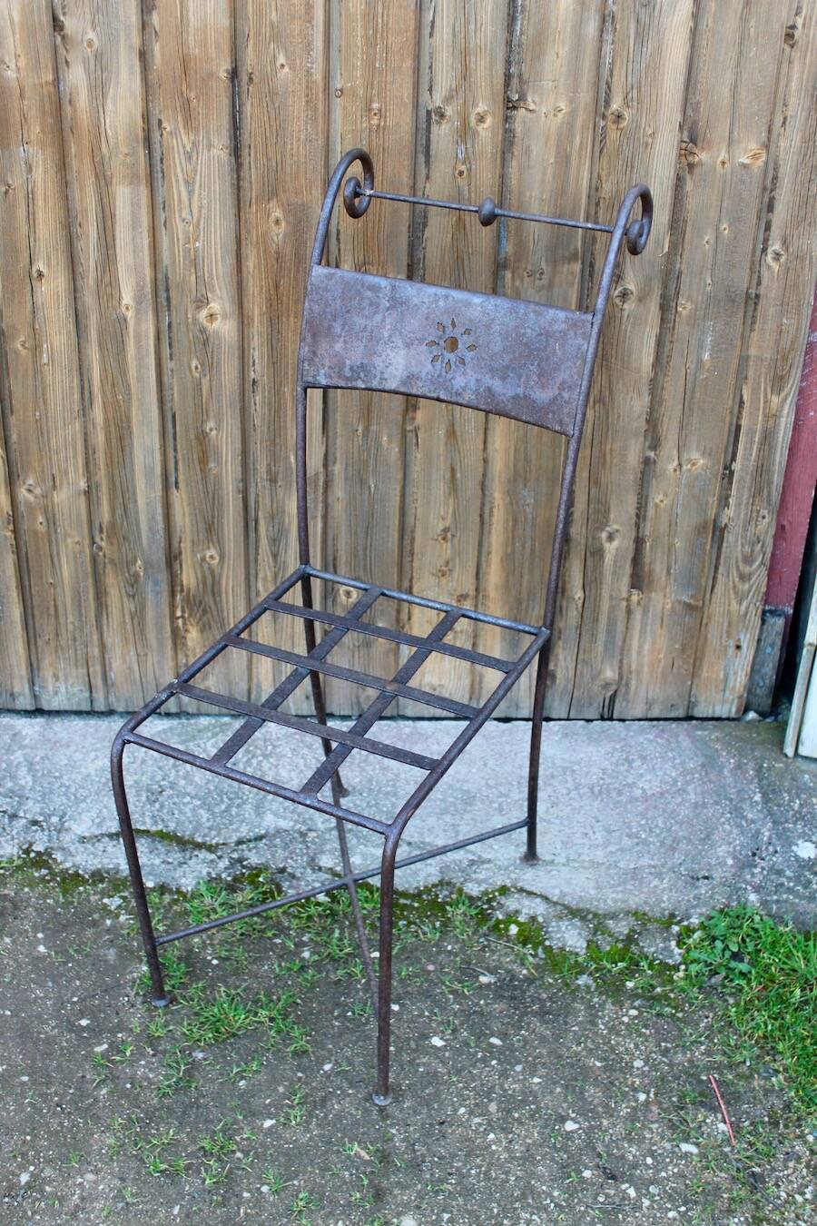Series of 8 wrought iron garden chairs