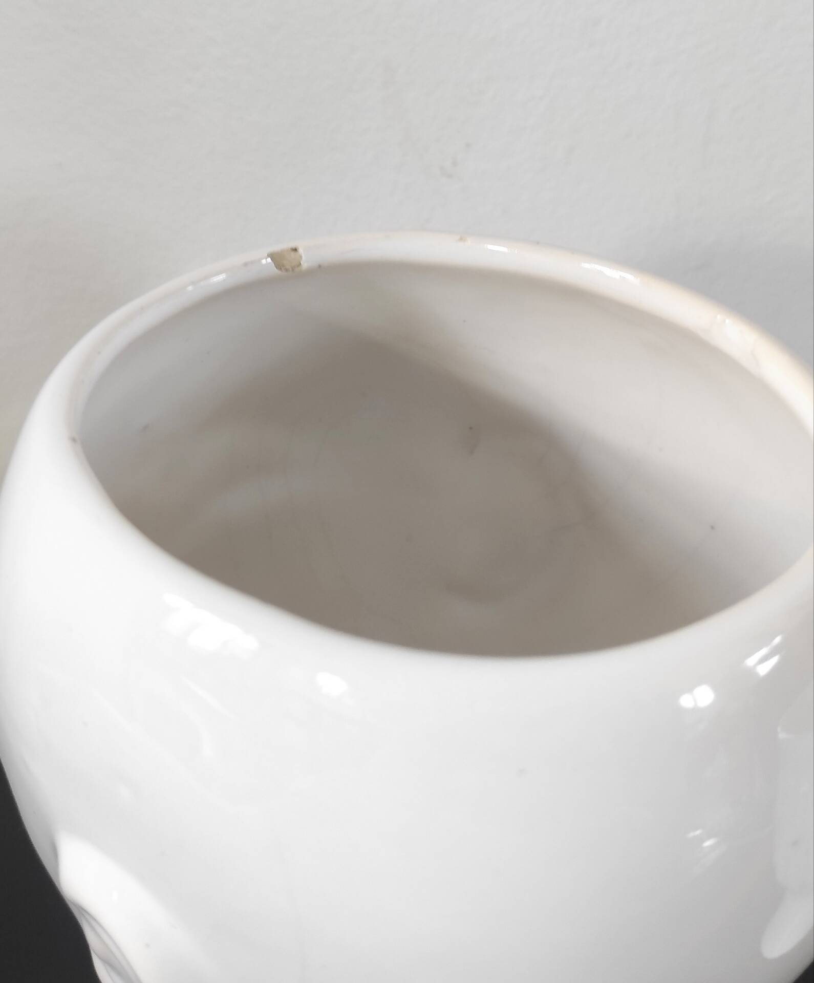 A pair of vintage ceramic plant pots.