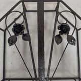 Pink-decorated iron umbrella door.