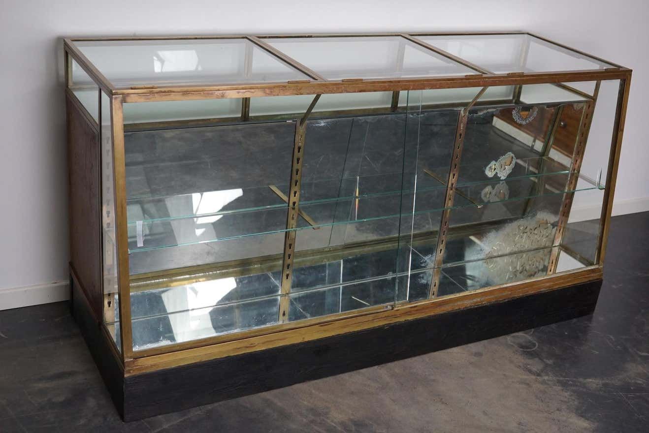 Counter or shop window in oak glass and brass France around 1920