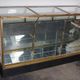 Counter or shop window in oak glass and brass France around 1920