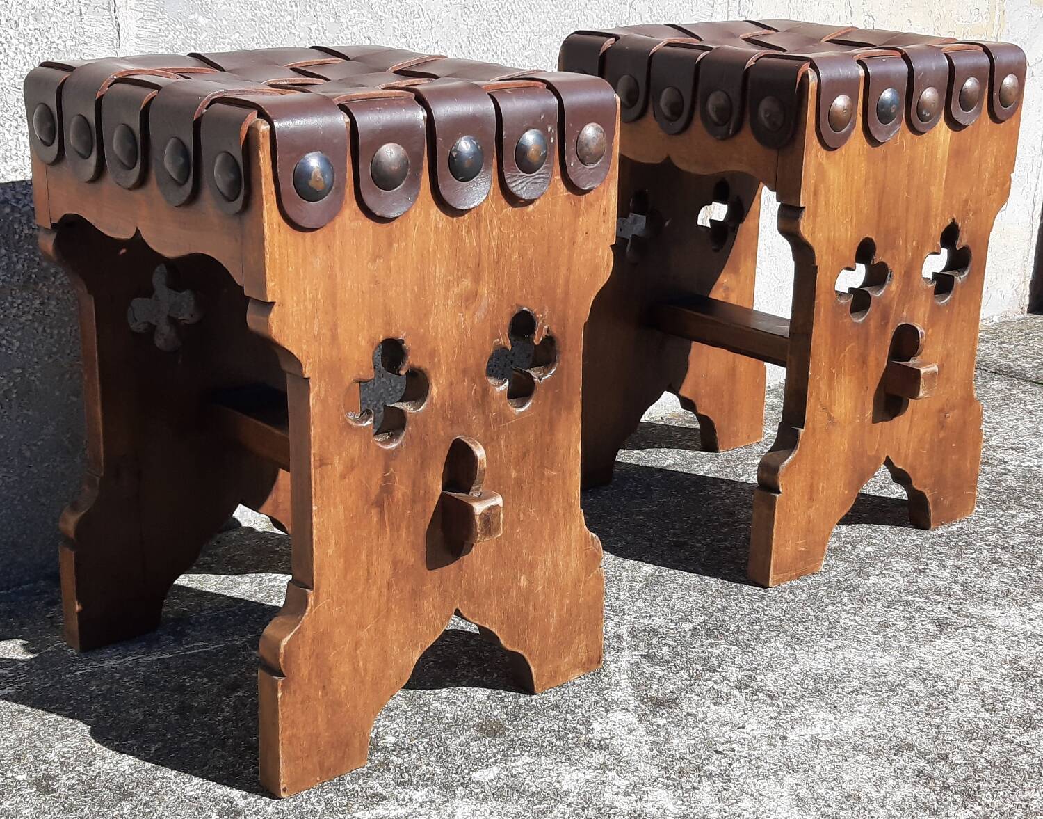 Pair of brutalist stools, leather seat.