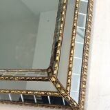 Mirror consisting of multi-faceted mirrors and brass garlands, French work, around 1970