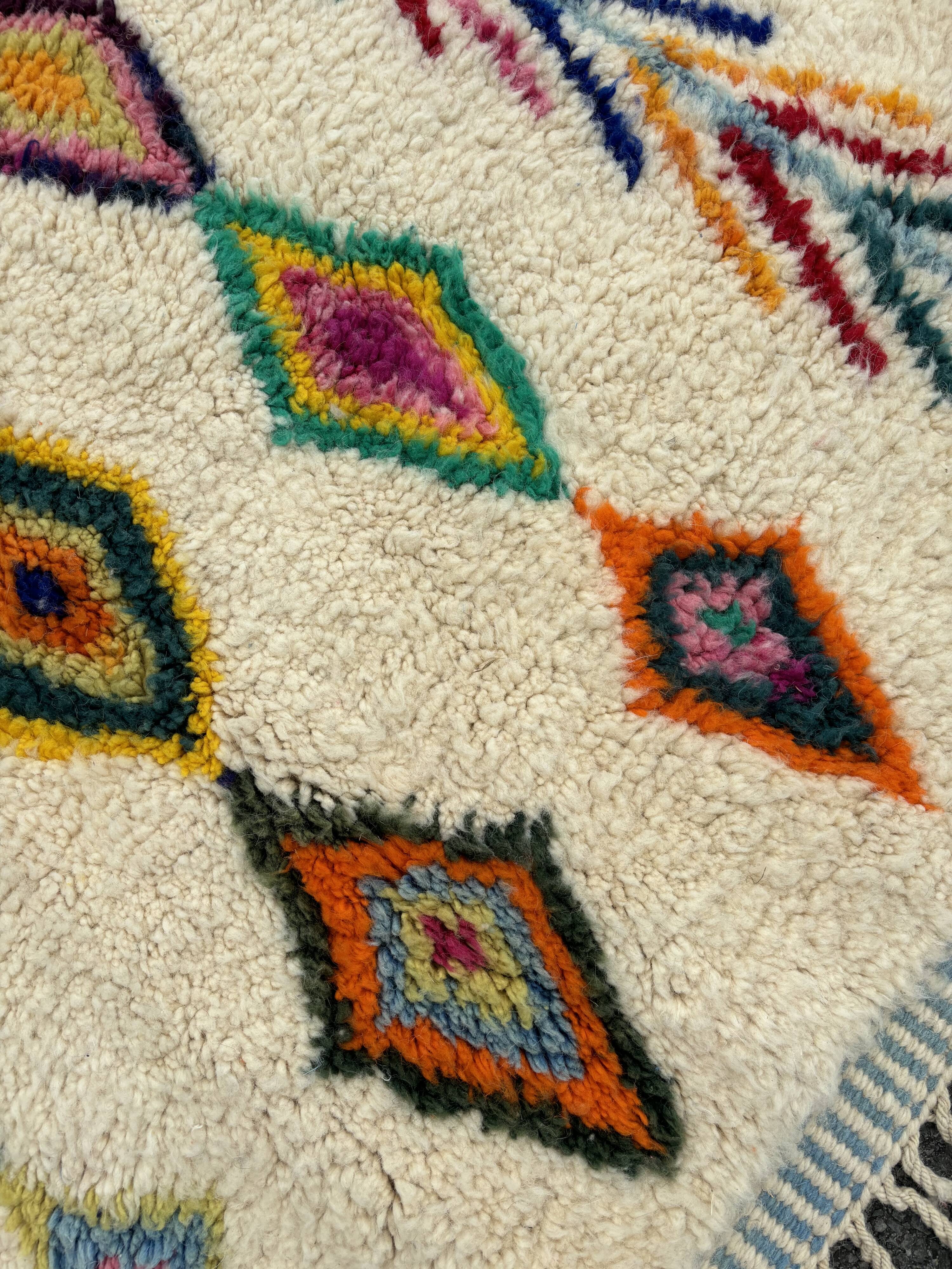 M'rirt Berber rug in cream wool with coloured patterns, 160 × 190 cm