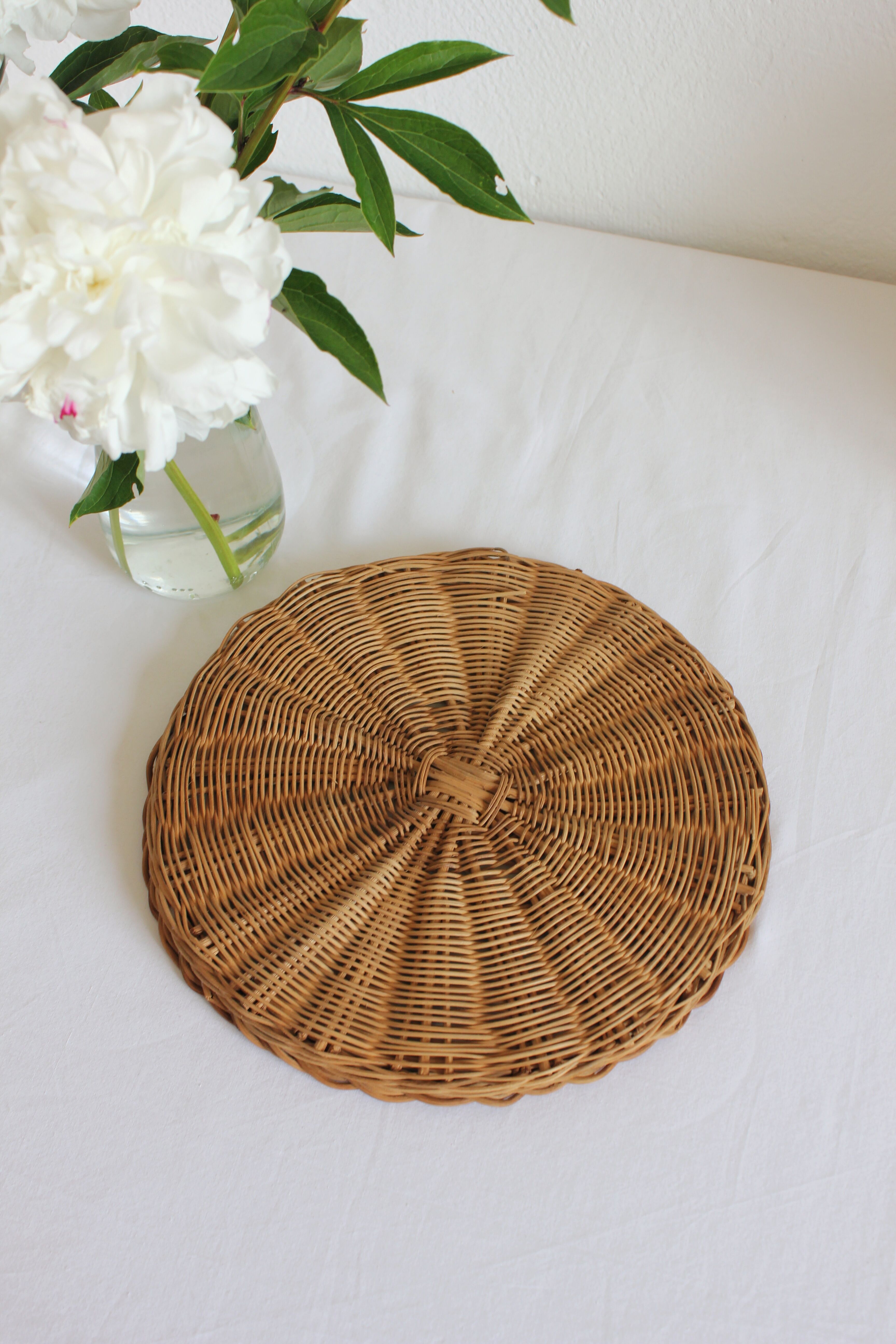 Decorative mirrored tray surrounded by vintage rattan/wicker