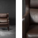 Brown leather wingback chair in mid-century modern Danish style, 1960s.
