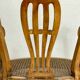 Fauteuil bas anglais en bois ajouré à assise cannée, 19e siècle