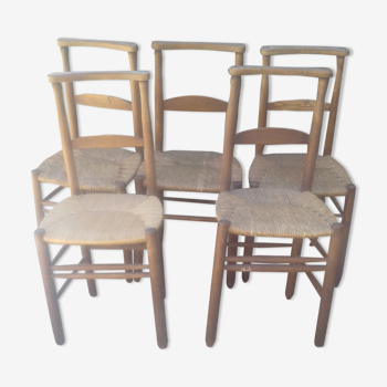 Set of five straw church chairs