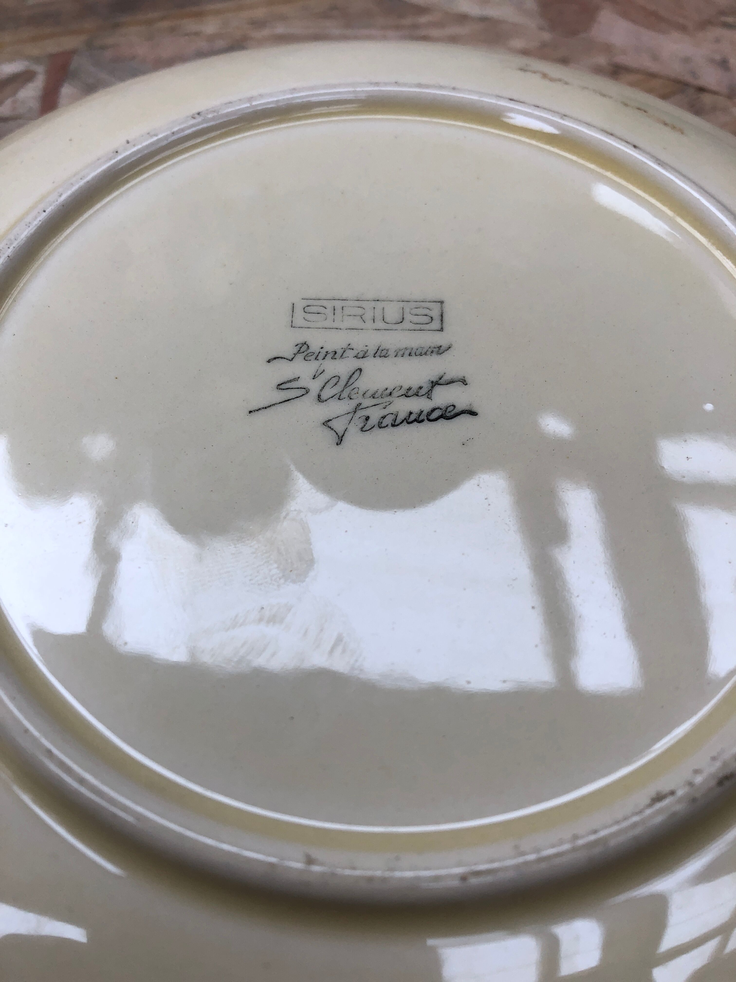 Set of 7 antique St. Clement Sirius pattern ceramic plates