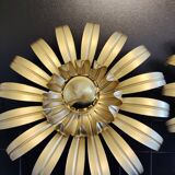 Golden metal flower sconces