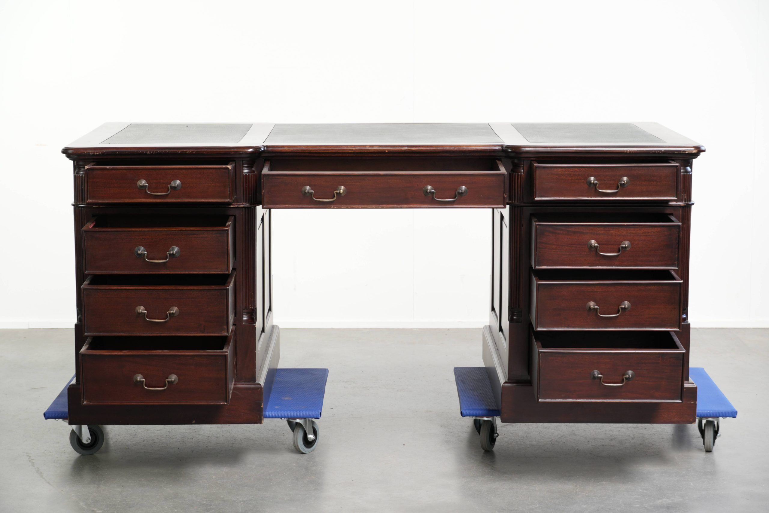 Partner desk in English style with dark wood and a green leather top