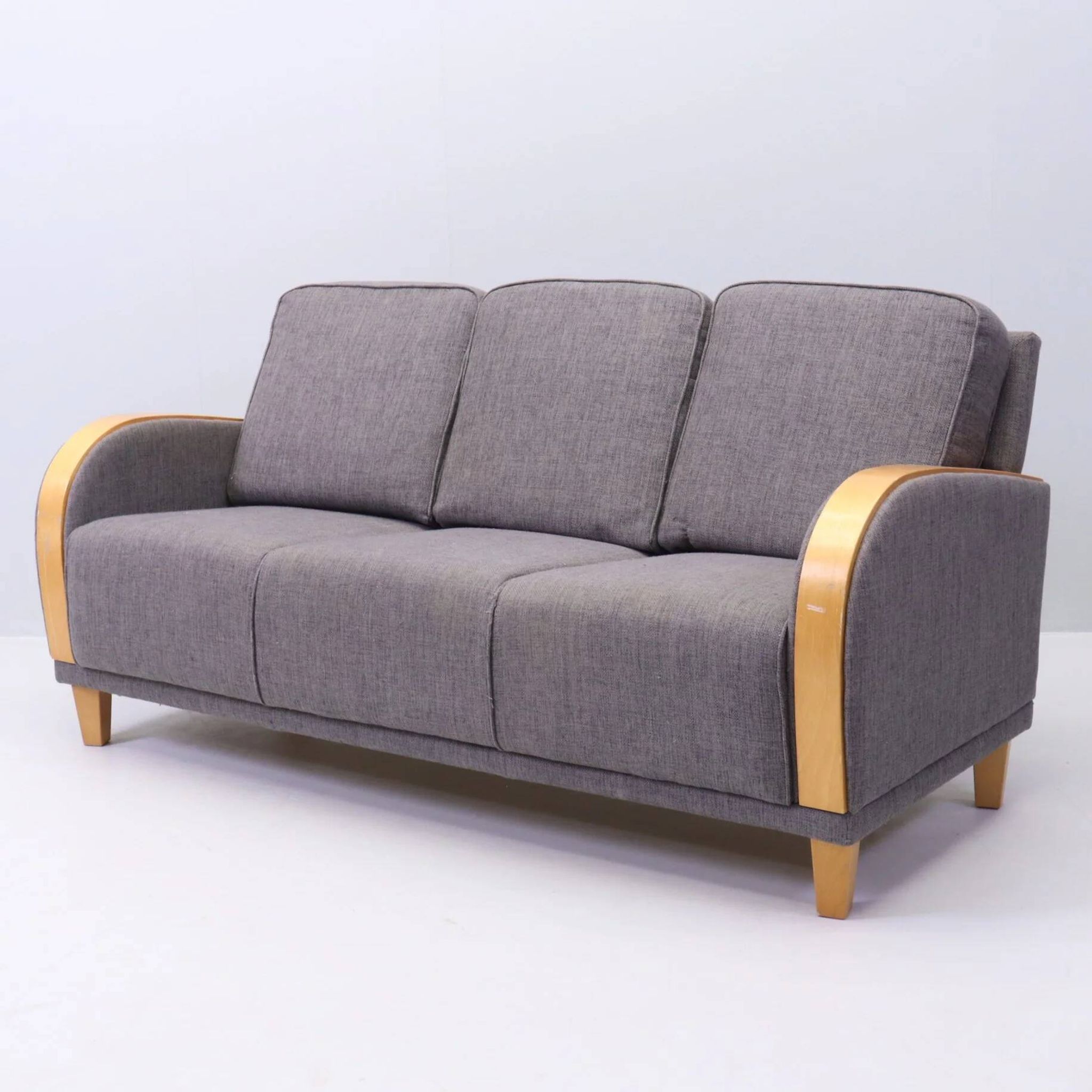 Three-seater Art Deco style sofa in grey fabric and curved wood.