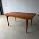 Rectangular extendable table with a Scandinavian design in solid teak.