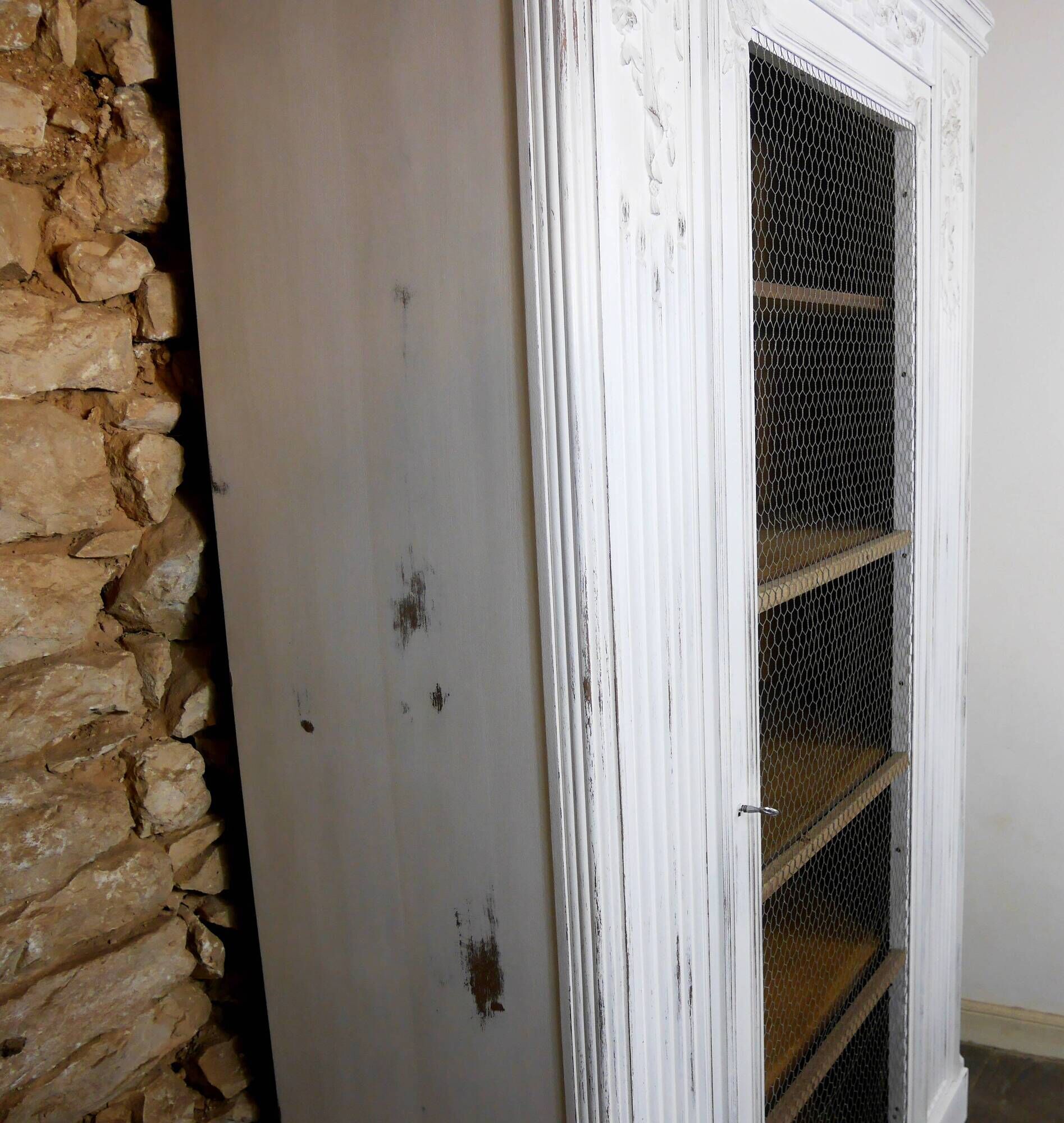 shabby wardrobe with Louis XVI style mesh door