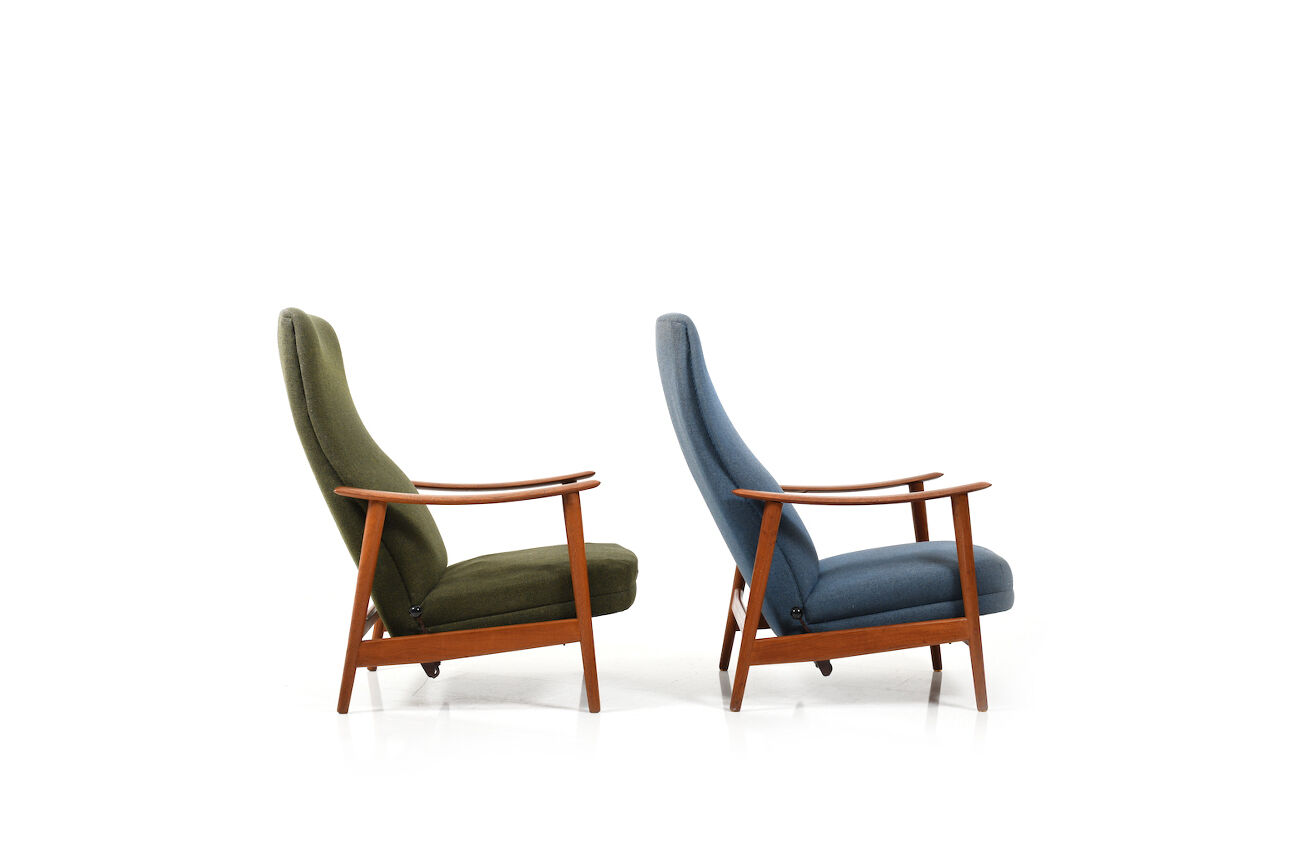 Pair of mid century Danish reclining lounge chairs in teak