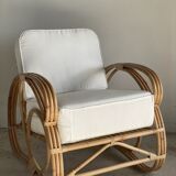 Large rattan rest chair and white cushions